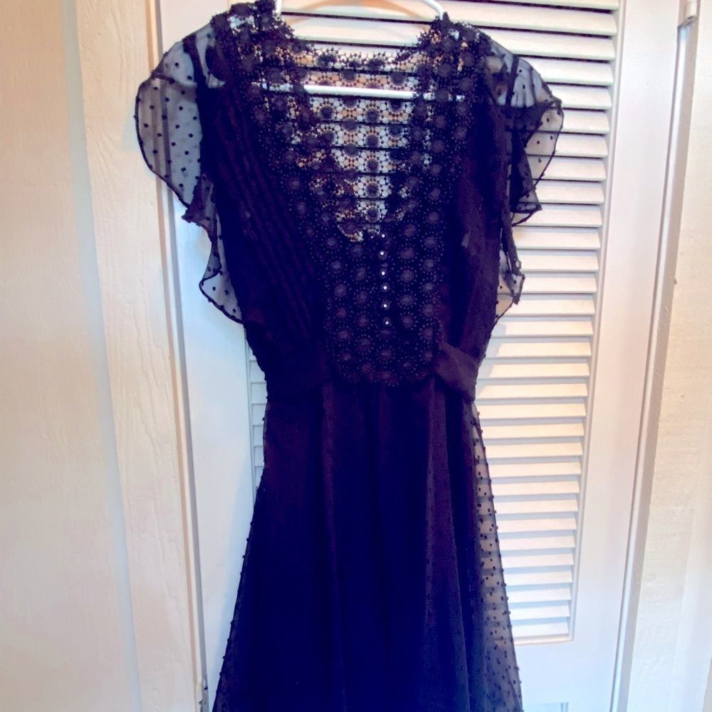 Liv navy swiss dot flutter cap sleeve tie waist mini dress